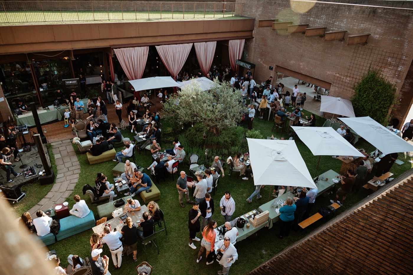 Overhead view of the courtyard and guests at Brut Merate