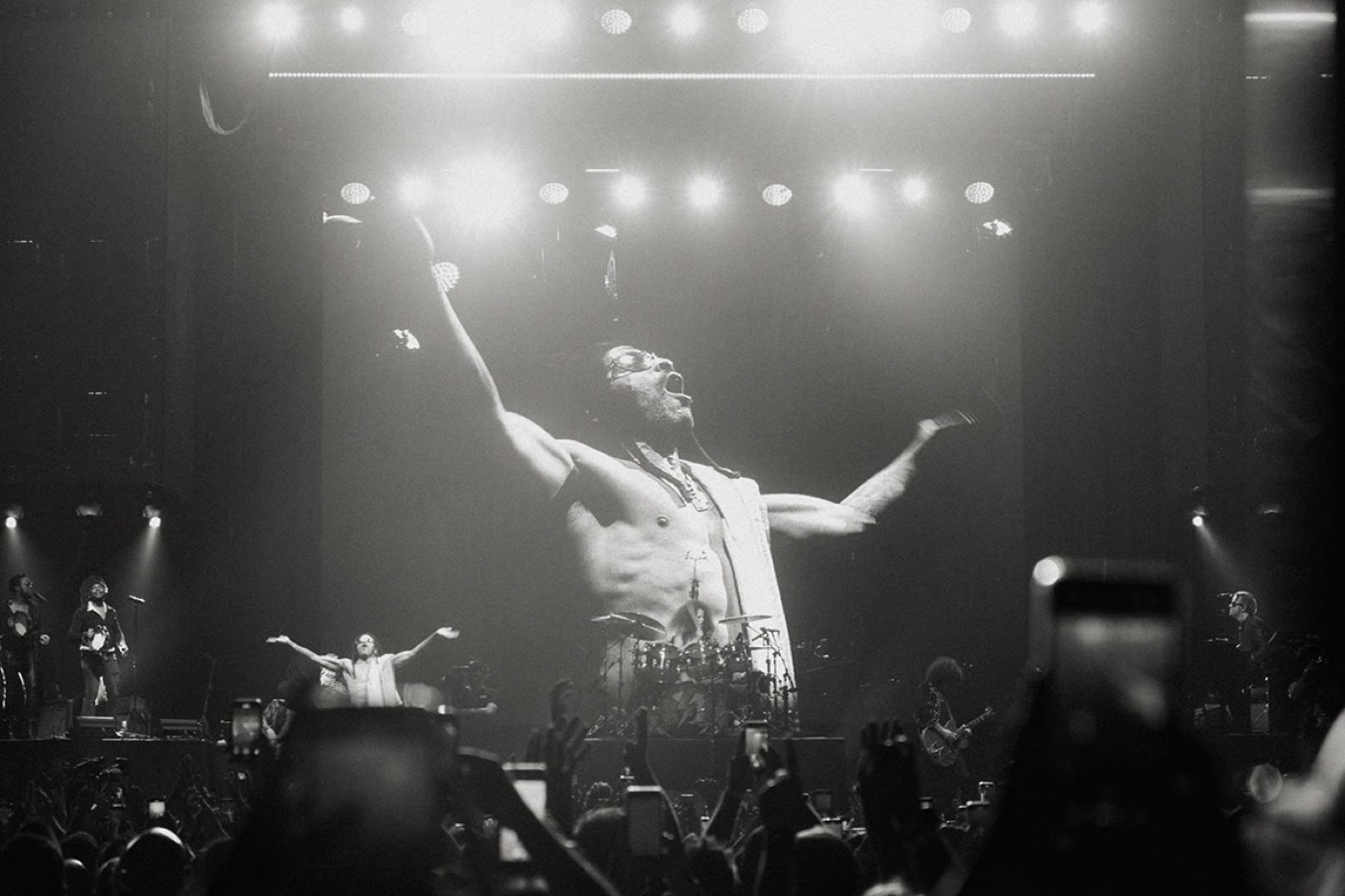 Performer on stage before a concert crowd