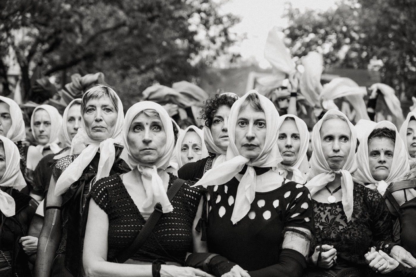 Women wearing white headscarves at Día de la Memoria