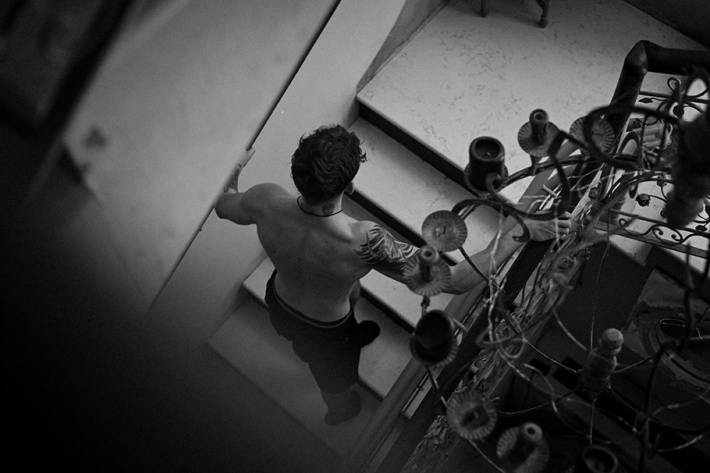 Overhead black-and-white scene at a workbench