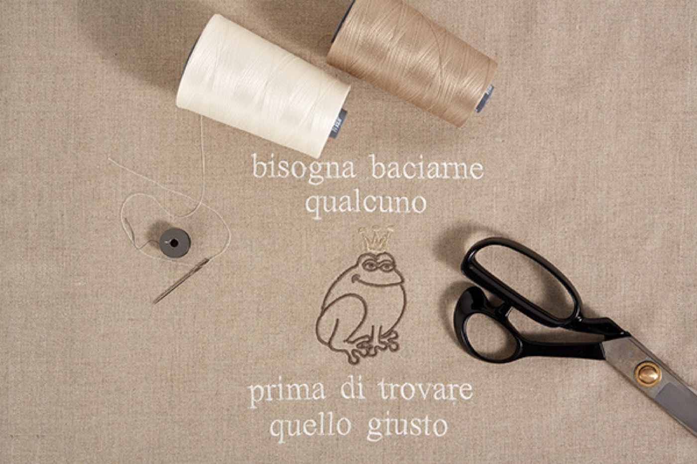 Embroidery detail with thread and scissors by Punti e Fantasia